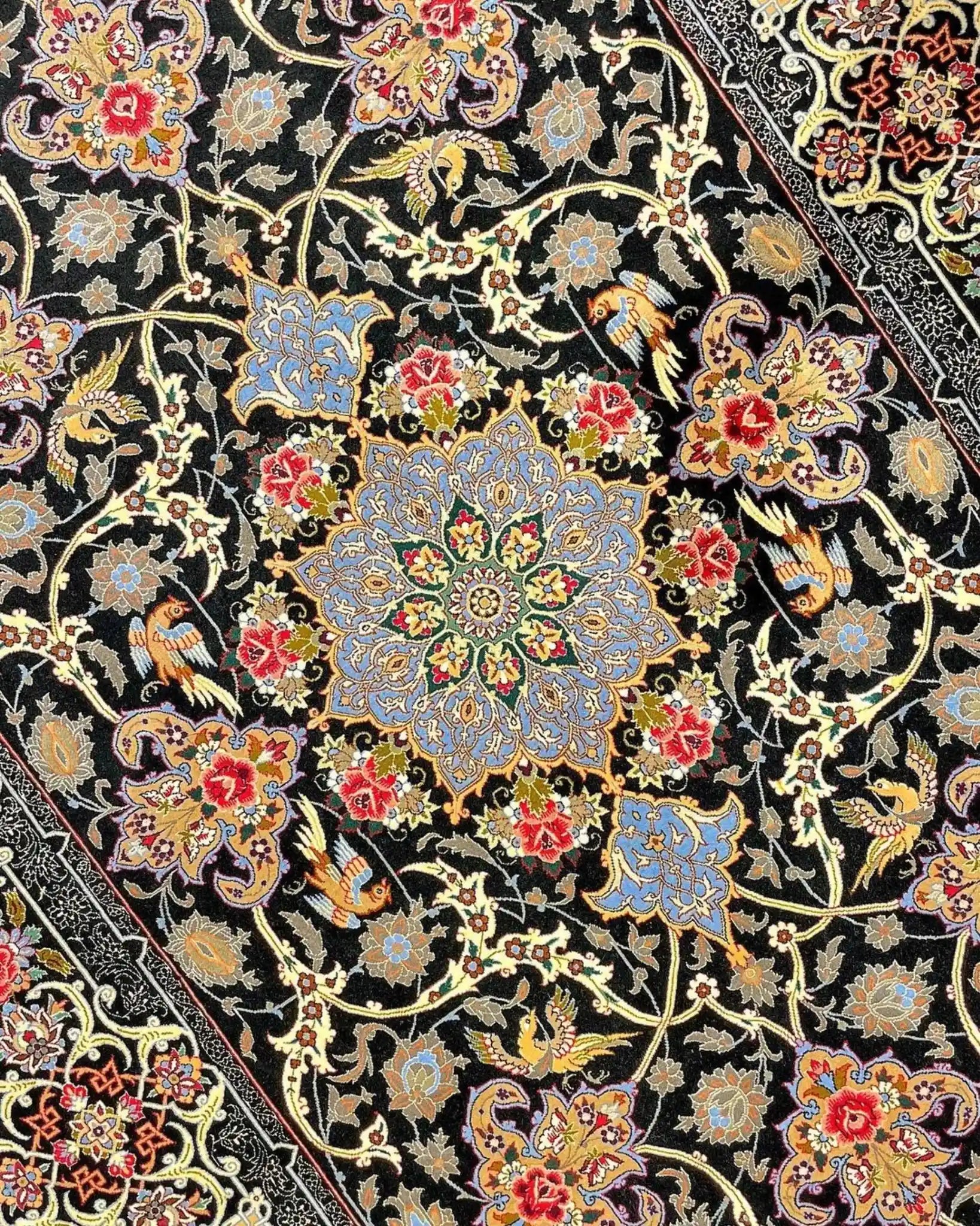 "Black and floral design Persian rug, crafted in Isfahan with silk and wool."